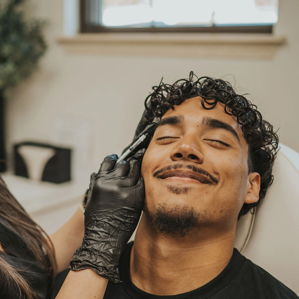Man receiving botox injection