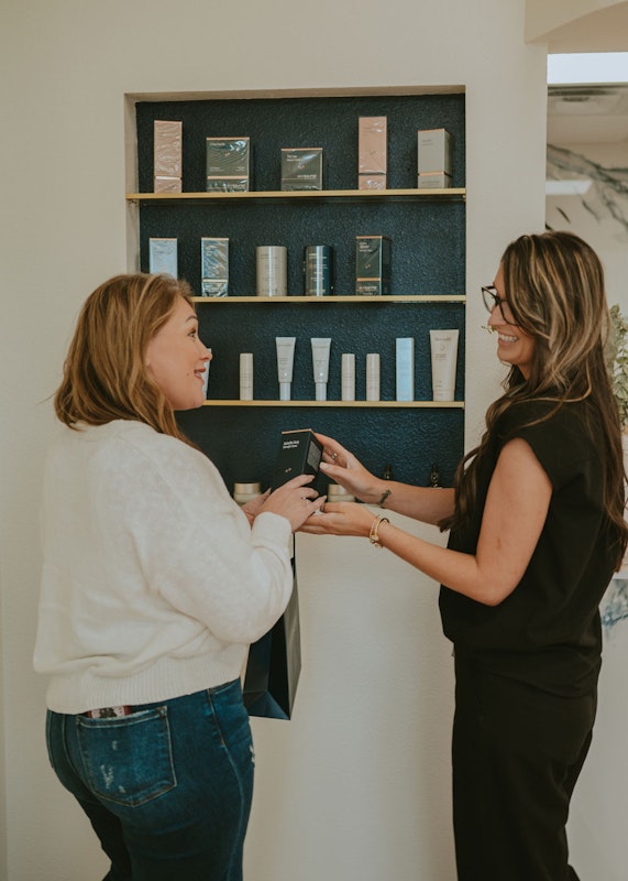 real patient with Trained Aesthetician looking at skincare
