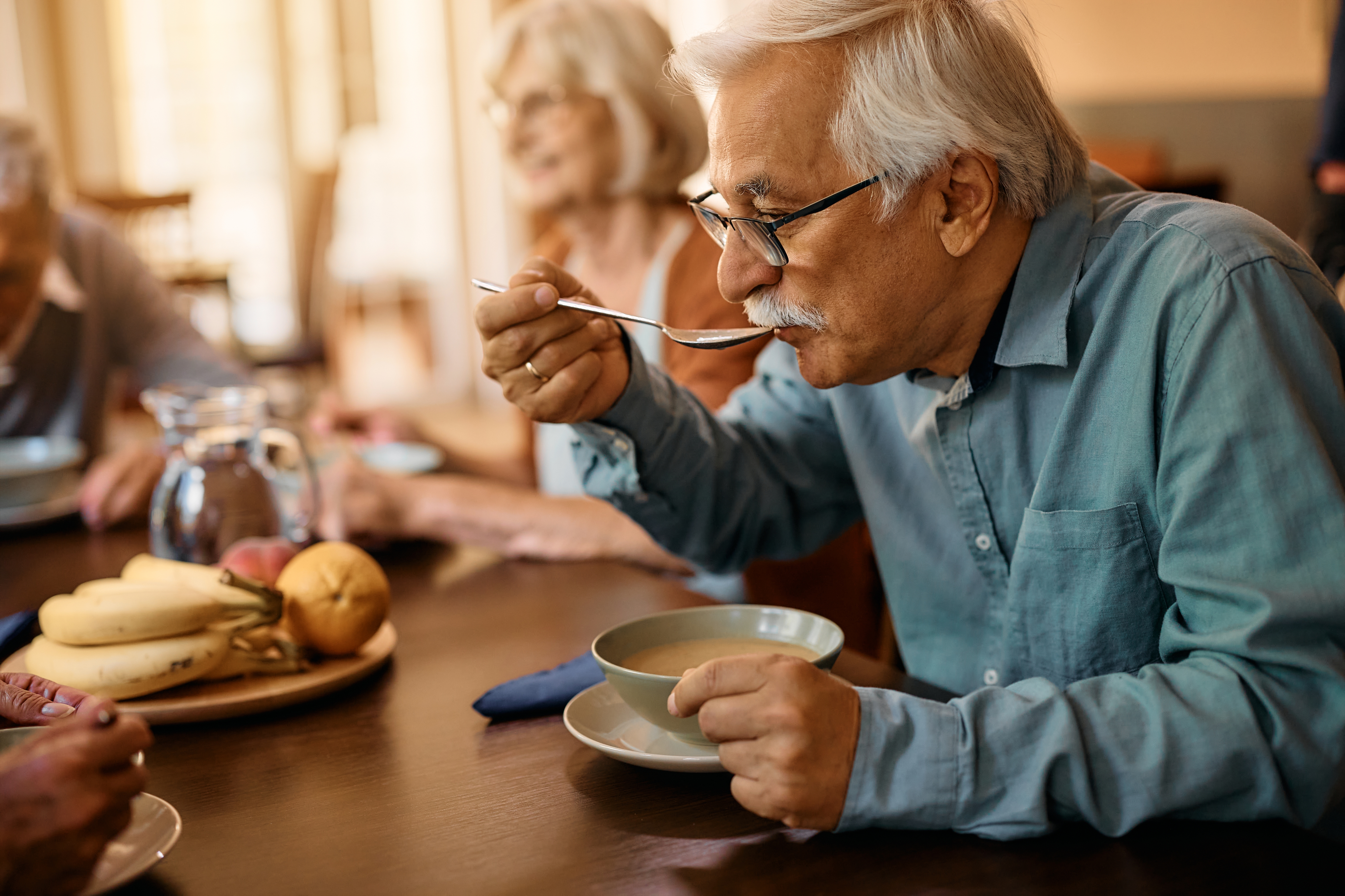 Man eating soup