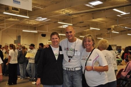 Three people smiling