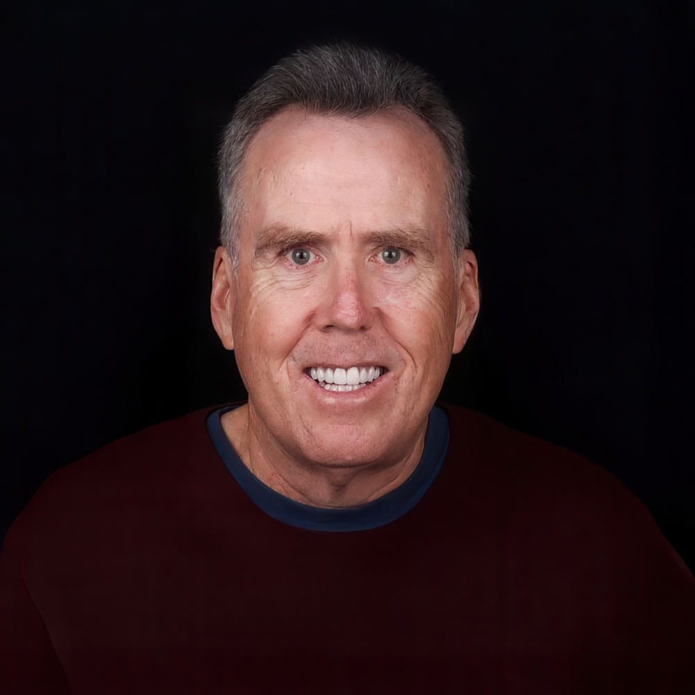smiling man with gray hair