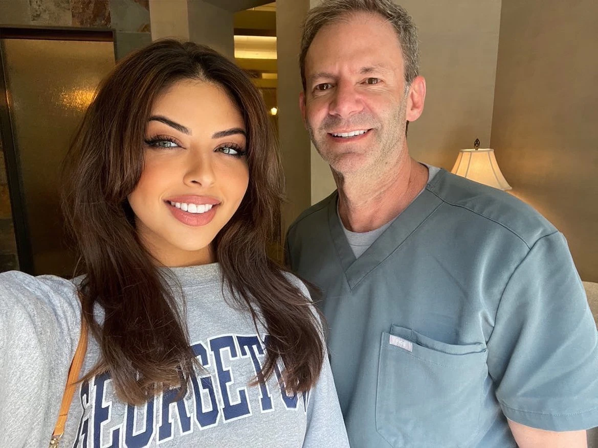 Dr. Myles smiling with real patient