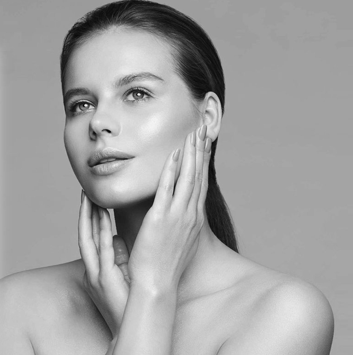 woman with hands on face