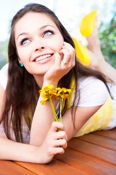 girl in yellow smiling