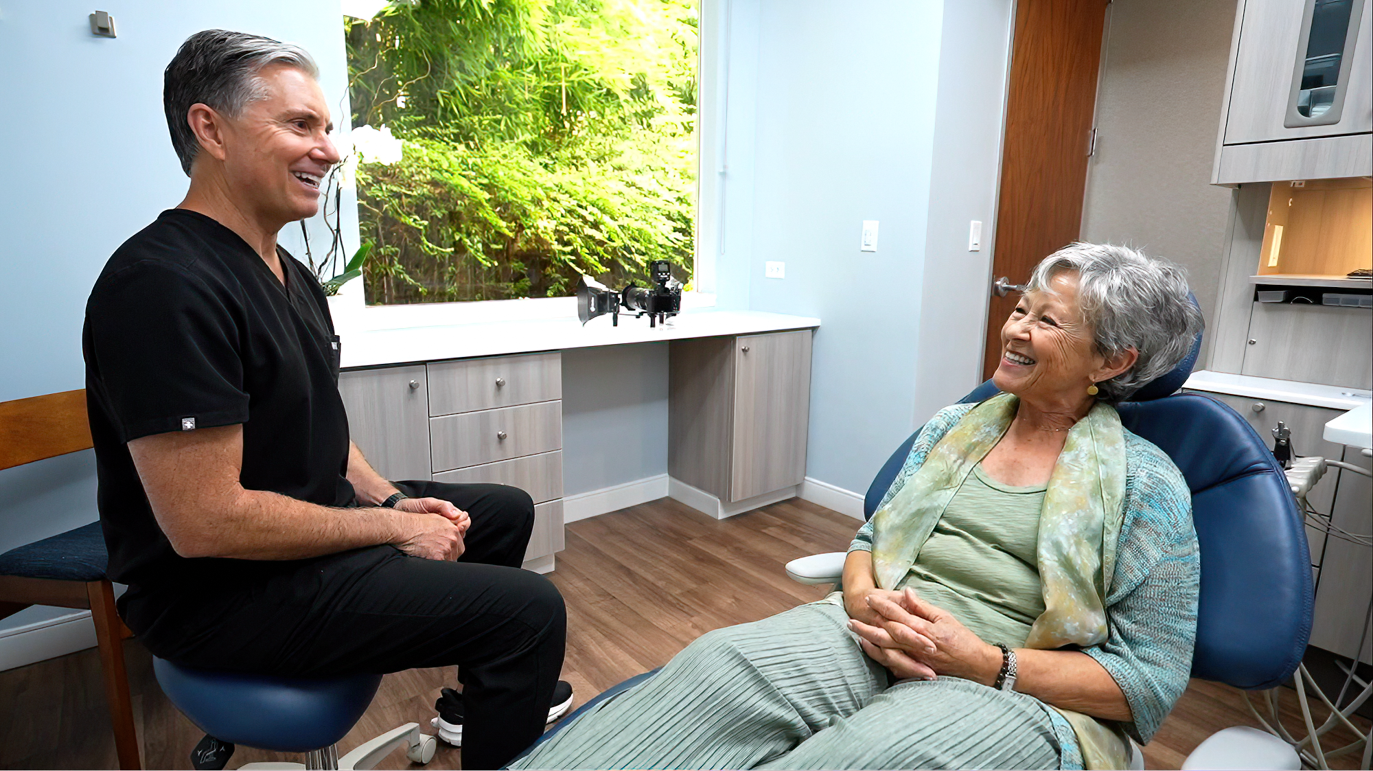 Dr. Catalano smiling with a patient