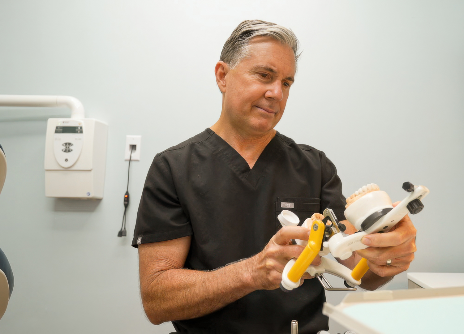 Dr. Catalano using dental technology