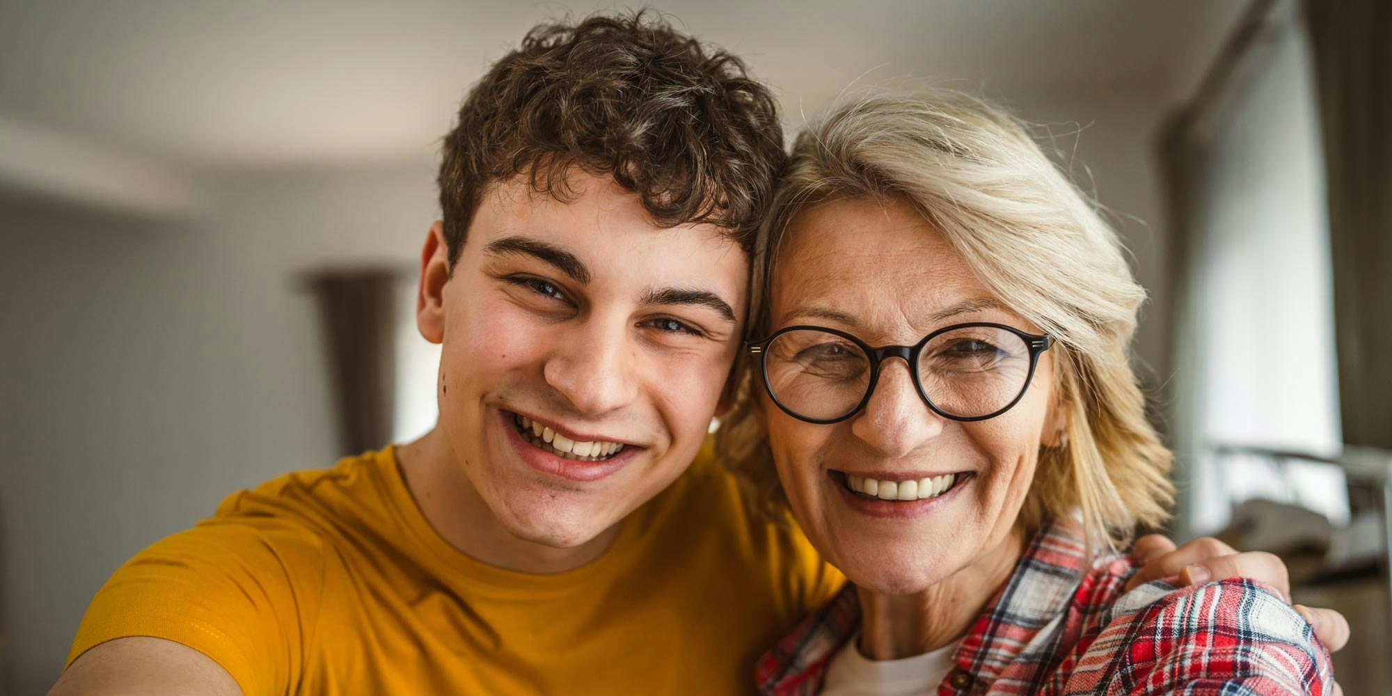 Boy smiling with his mother