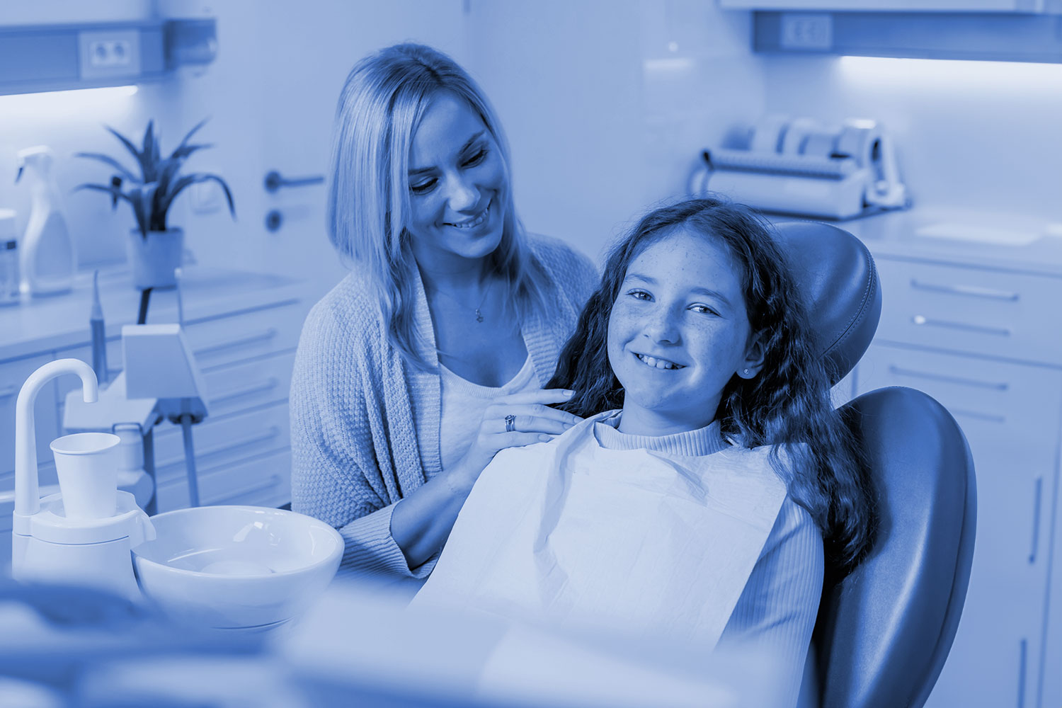 Teen girl smiling in dental chair in Centennial