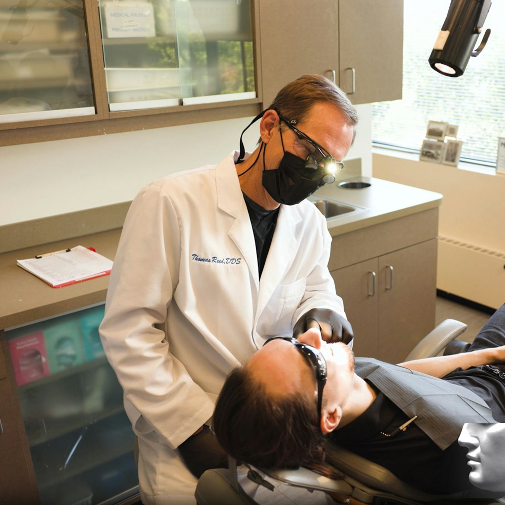 Dr. Reed examining a patient