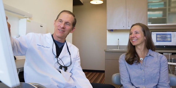 Dr. Reed consulting with a patient