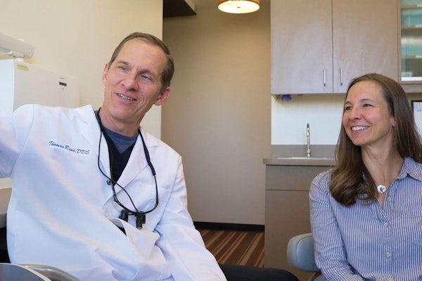 Dr. Reed consulting with a patient