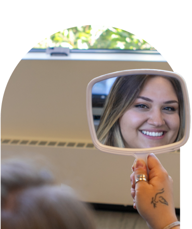woman smiling in mirror