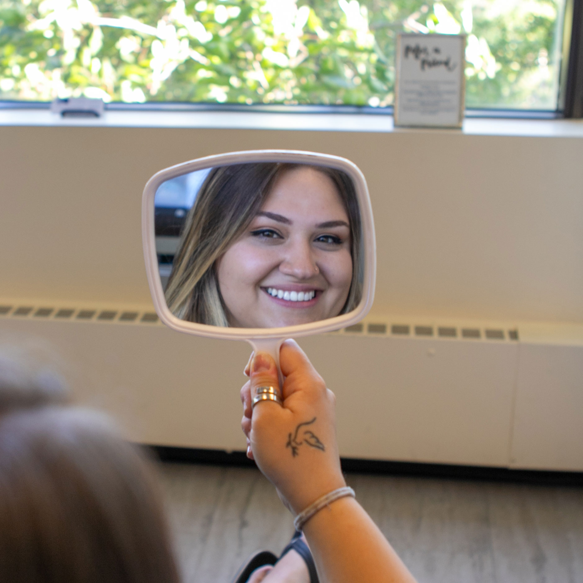 patient smiling in mirror