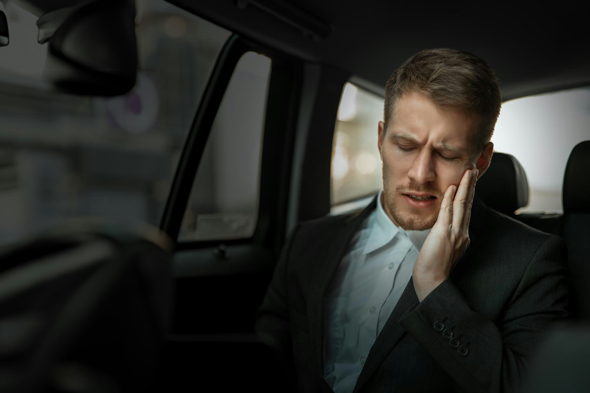 Young man with tooth pain