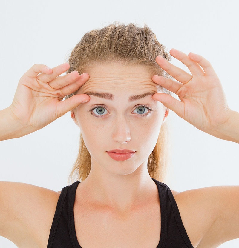 young woman showing forehead wrinkles