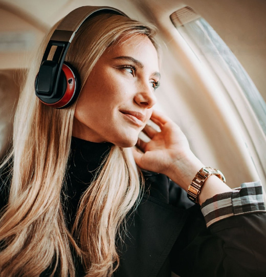 Smiling plastic surgery patient on a plane