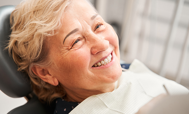 Smiling Senior Woman in Dental Chair