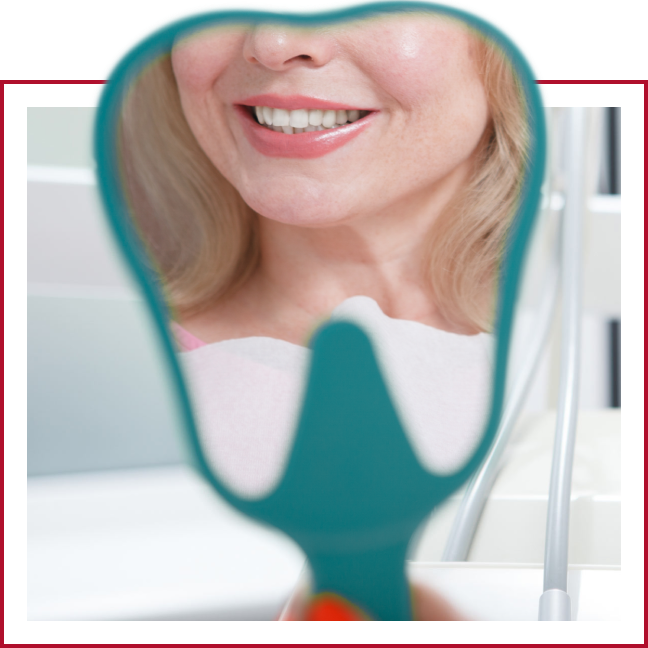 Reflection of dental patient in a hand mirror