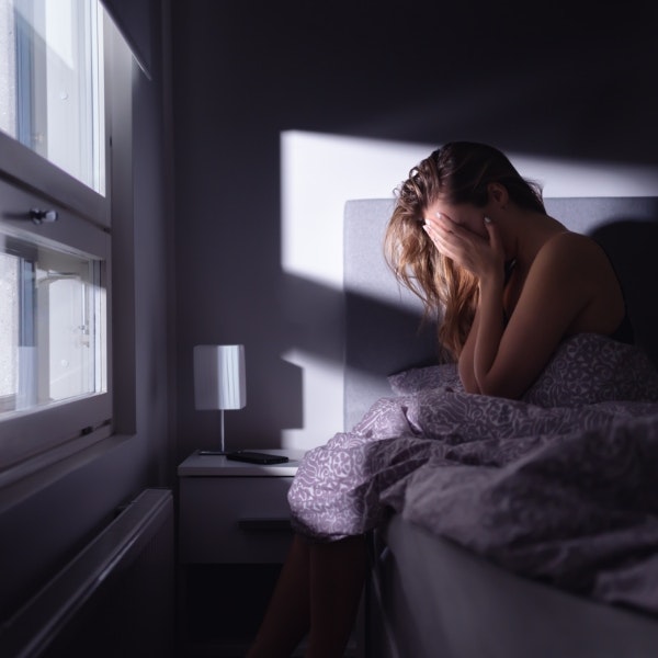 traumatized woman in bed