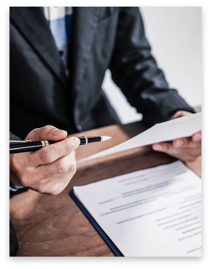 Attorney holding pen and paperwork