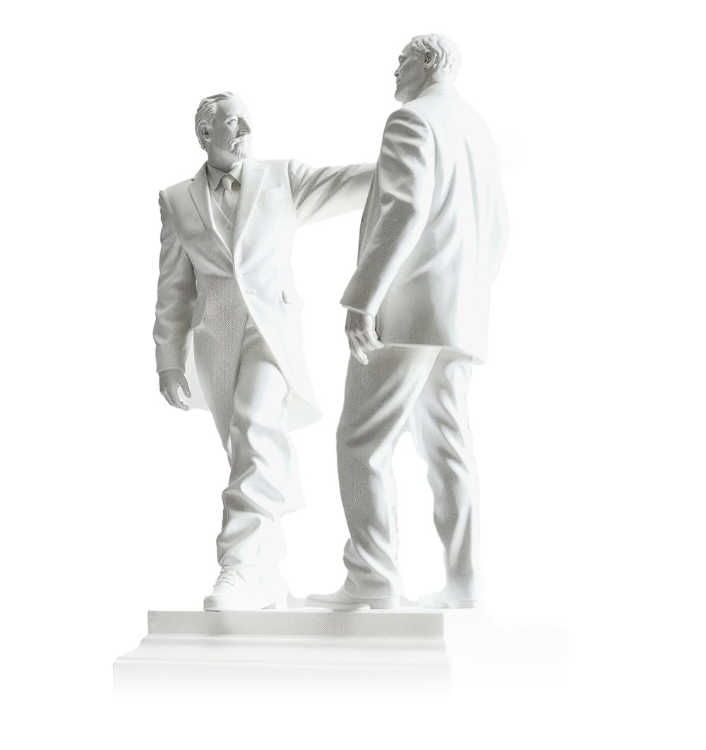 A statue of a businessman walking away