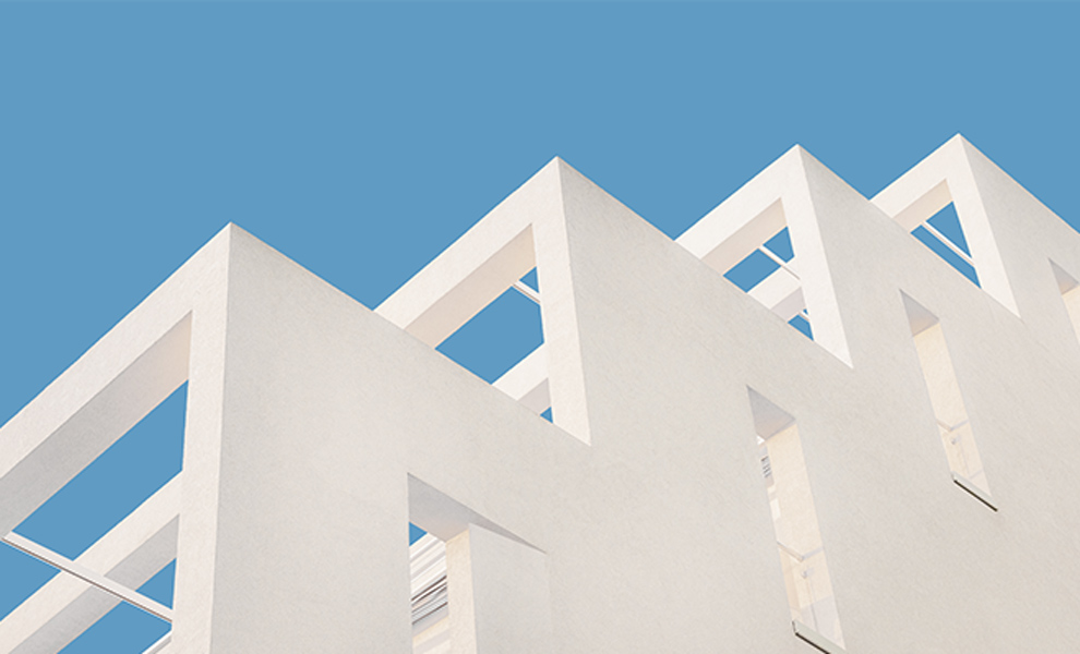 White building with modern design against blue sky