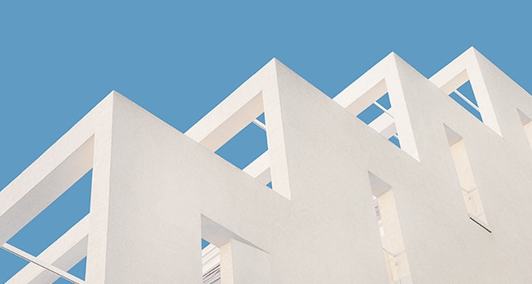 White building with modern design against blue sky