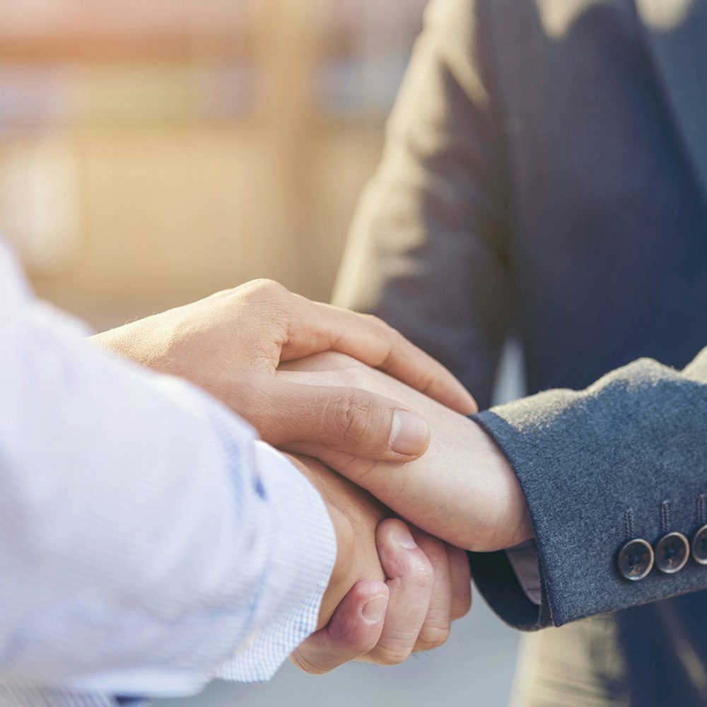 Lawyer and client shaking hands