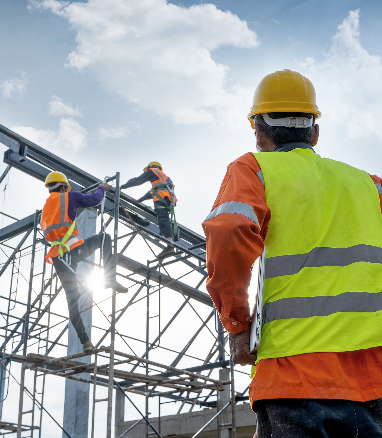 Construction workers building a house