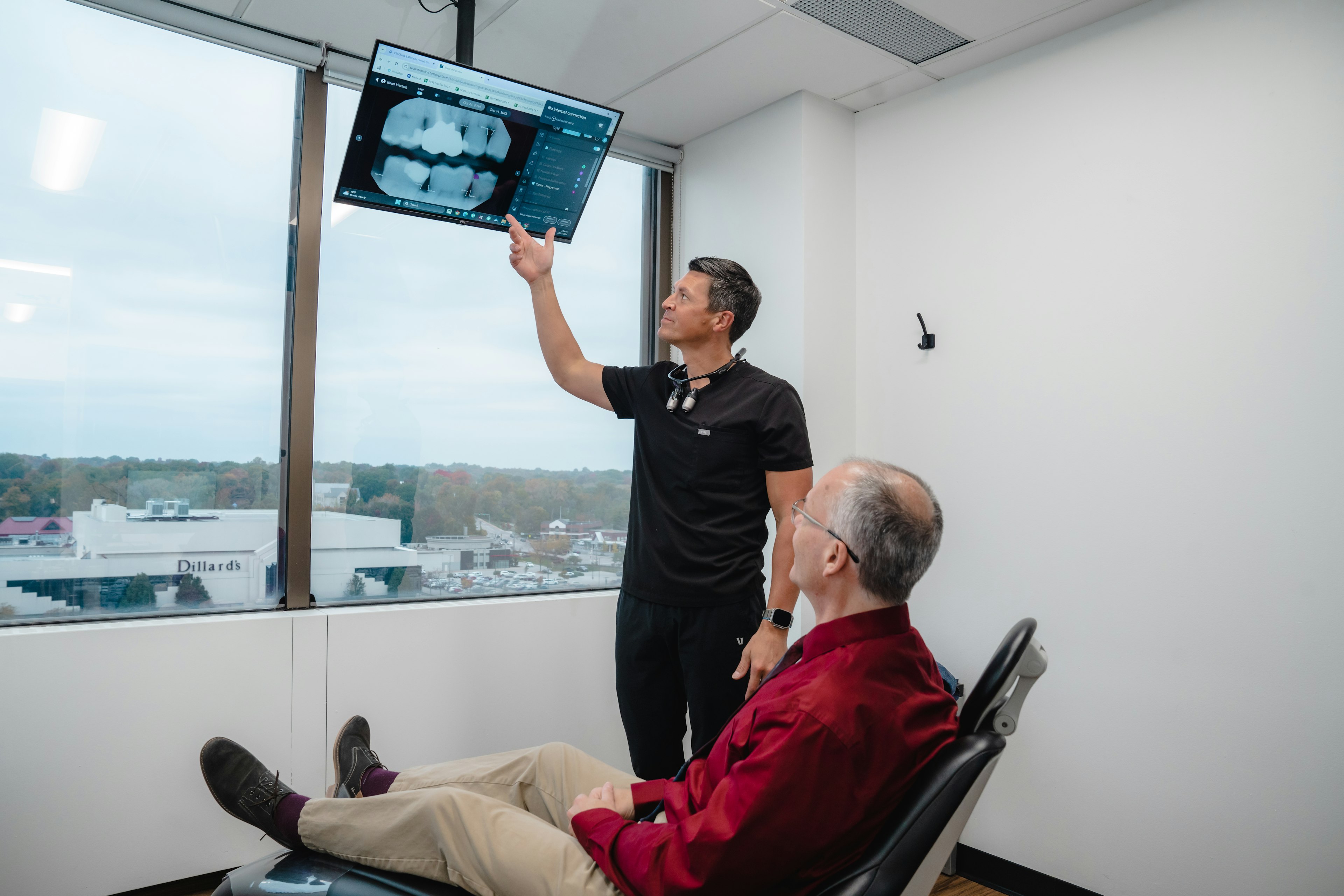 Dr. Chris Hill Pointing At Patient Xray