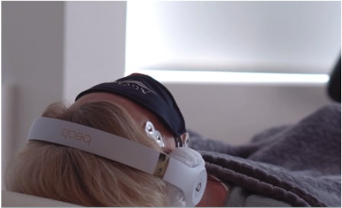 person with eye mask and headphones