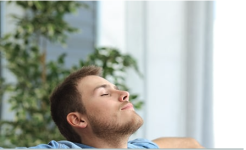 man smiling with eye closed