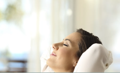 woman smiling with eye closed