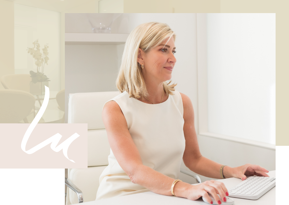 Dr. Lindsey Marshall at her desk, typing on a keyboard