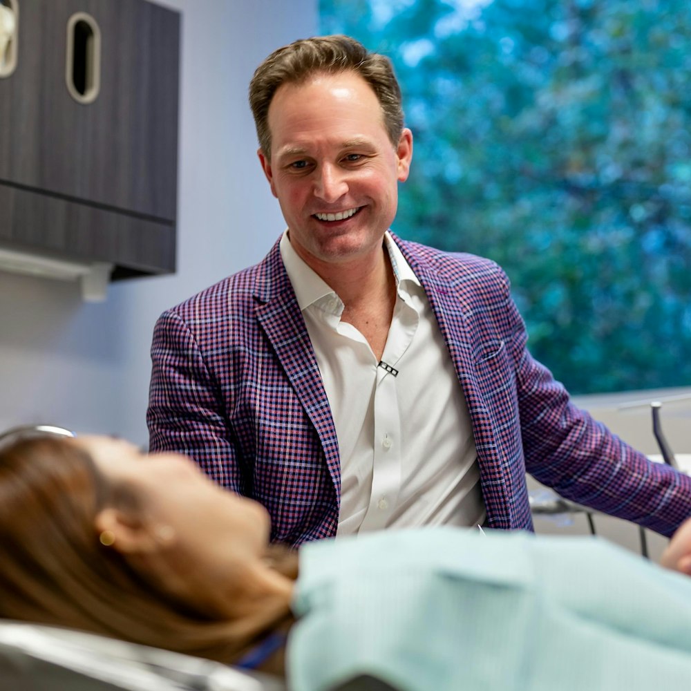 Dr. Scott Young smiling with a patient