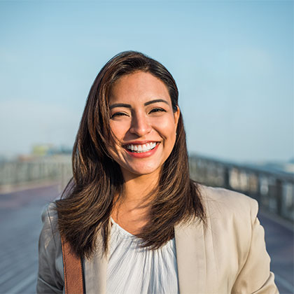 Woman smiling after cosmetic dental care
