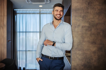 Man confidently smiling after cosmetic dentistry