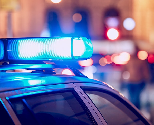 cop car behind a truck