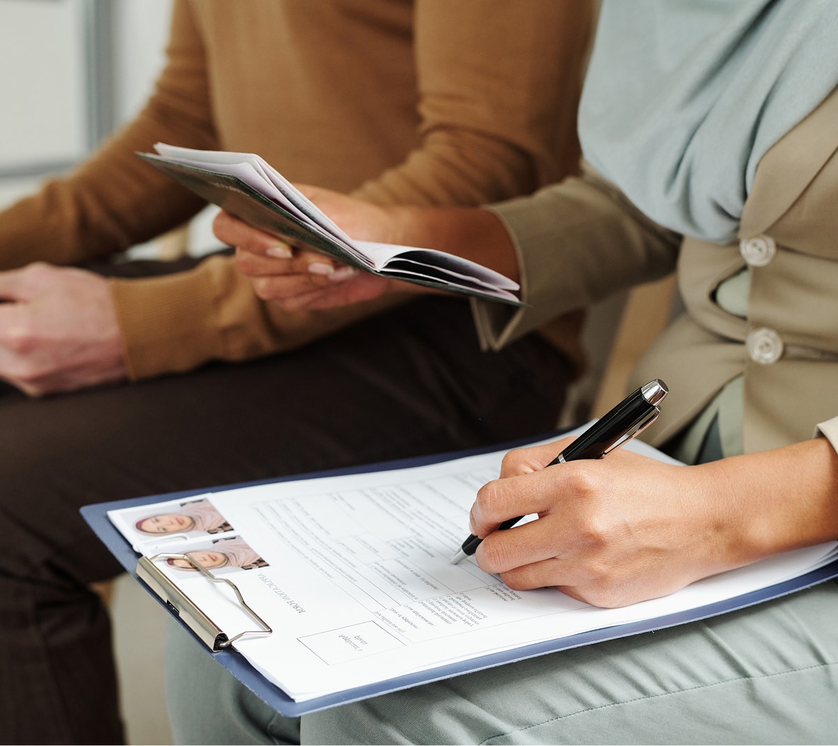 woman filling out immigration forms