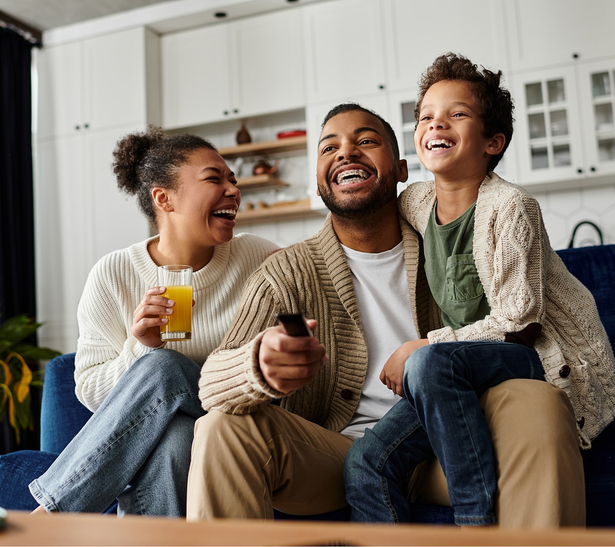 family sitting together on the couch