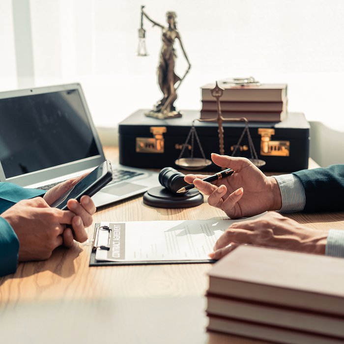 men having a conversation over legal documents