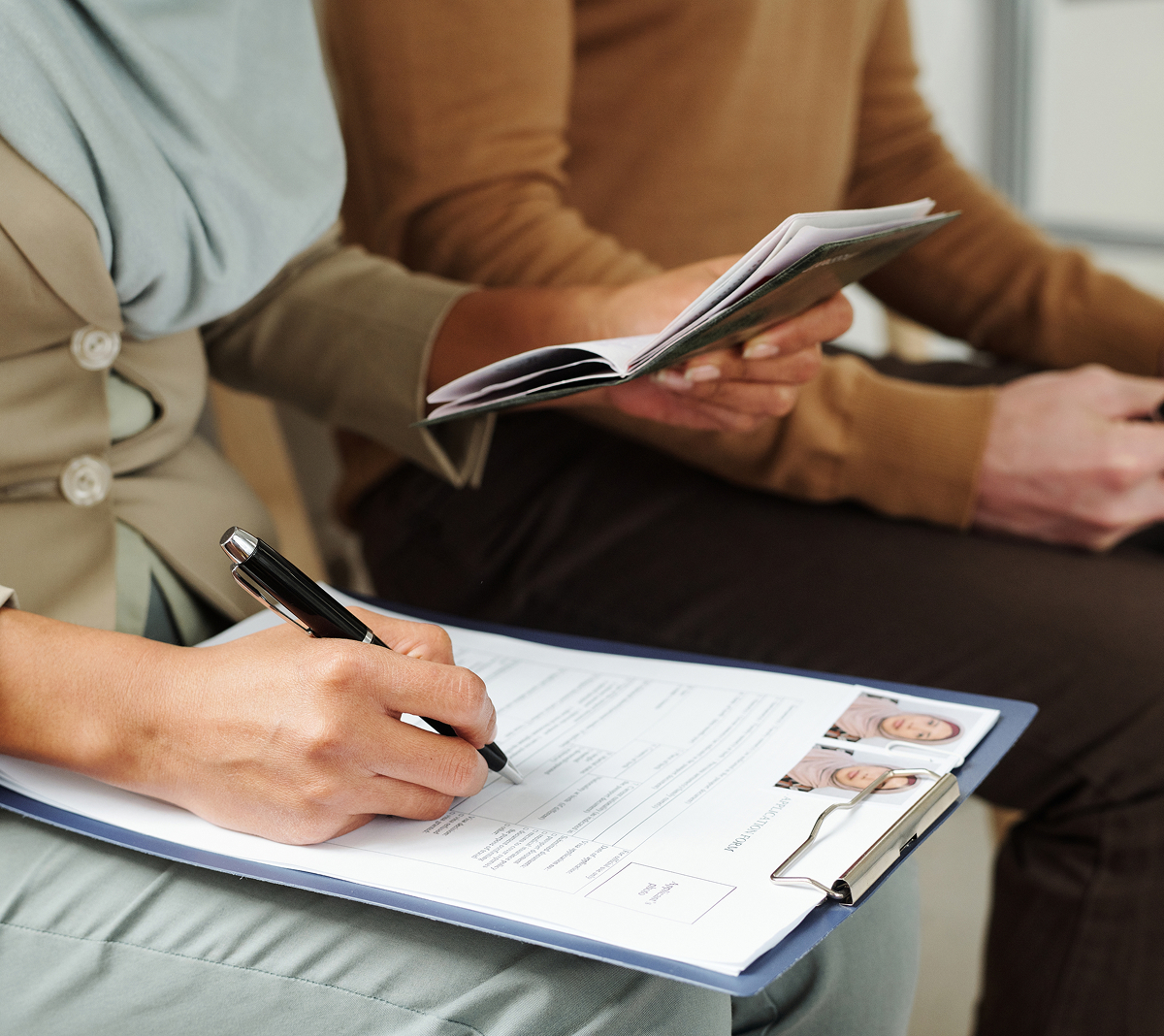 Person filling out immigration paperwork
