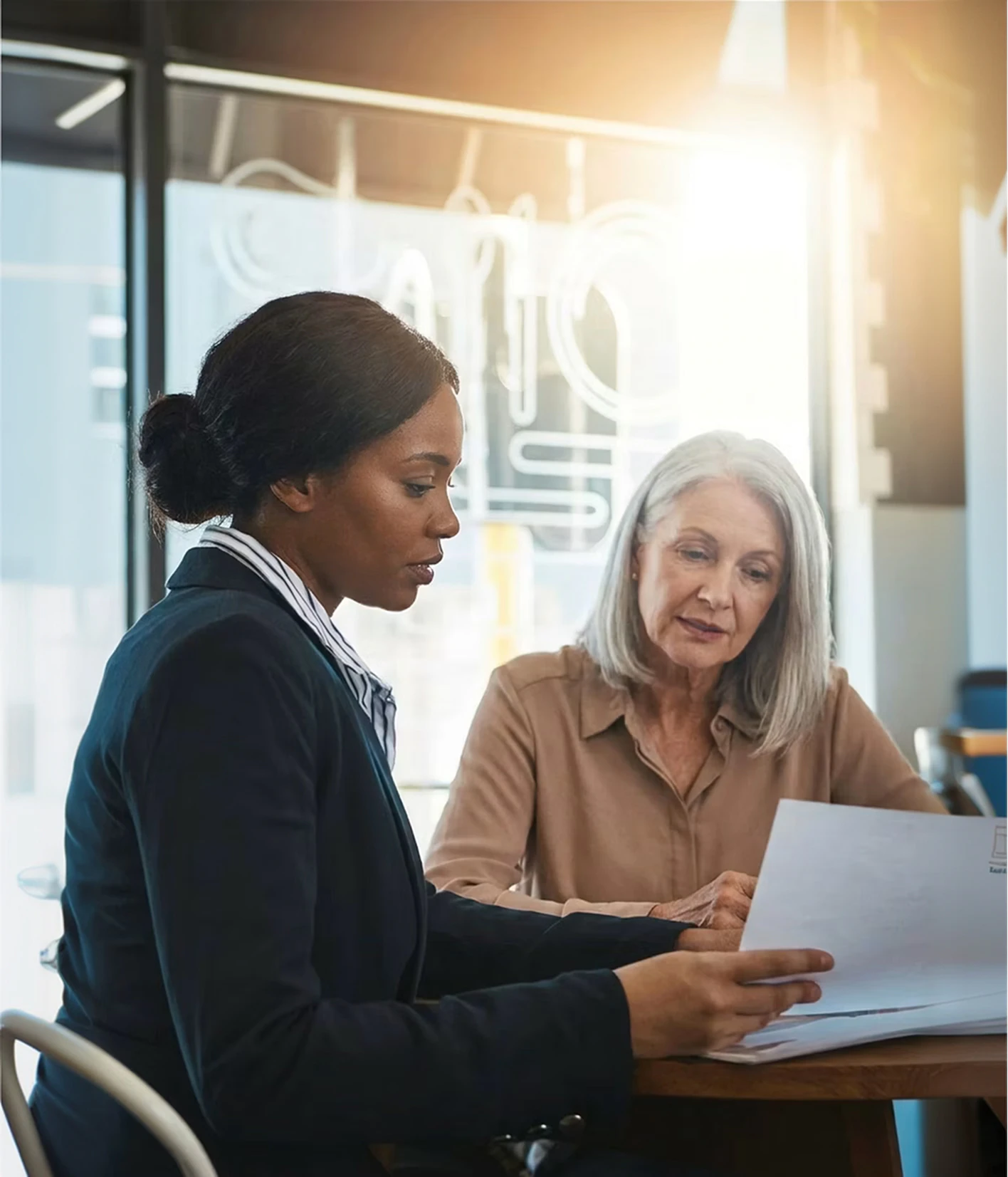 Two women going over contract