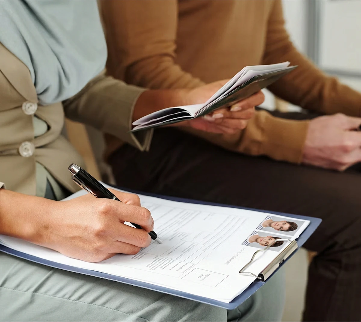 woman writing on document