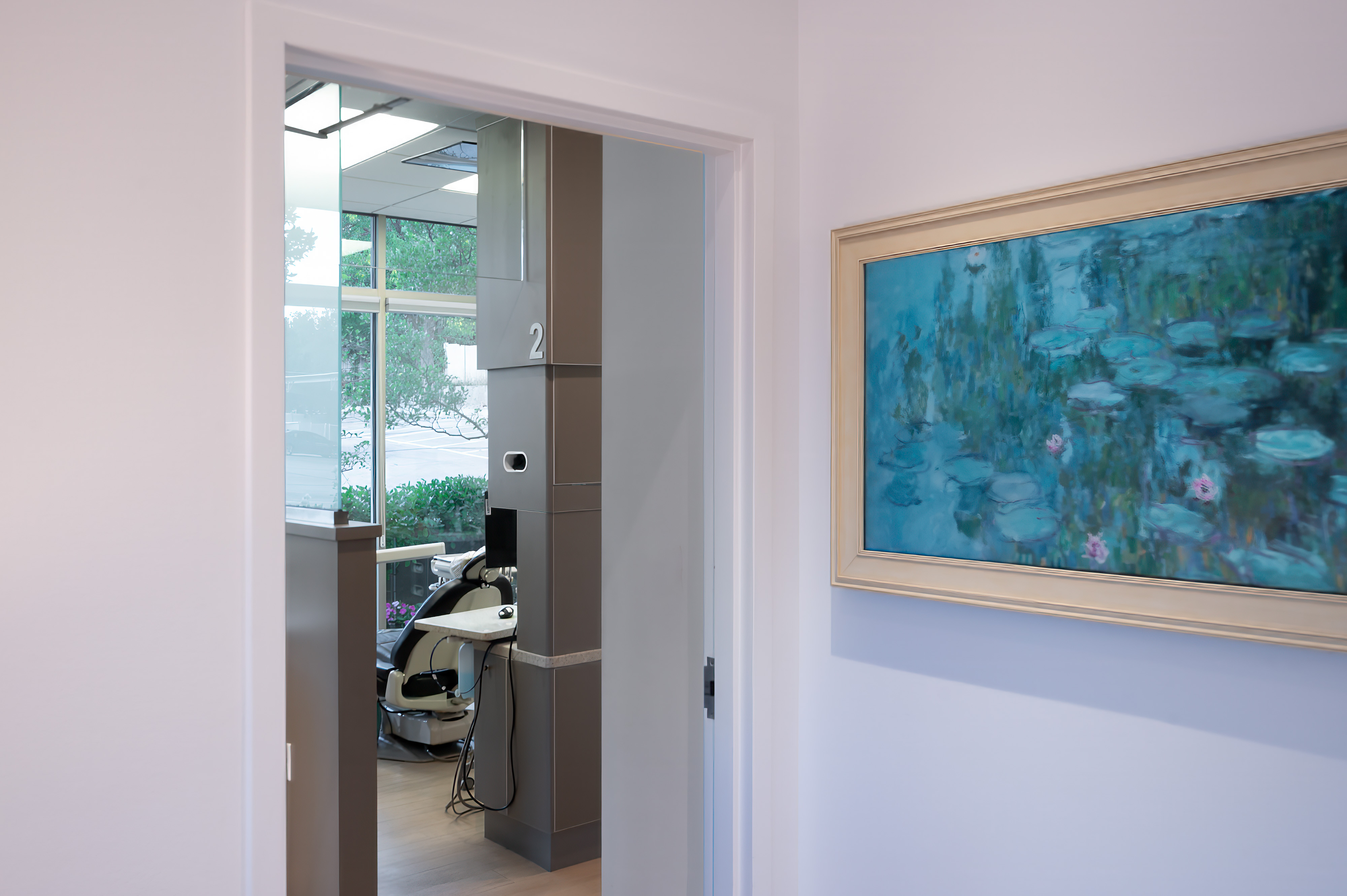 Operatory room at Allan S. Thomas dental office with treatment chair and large window