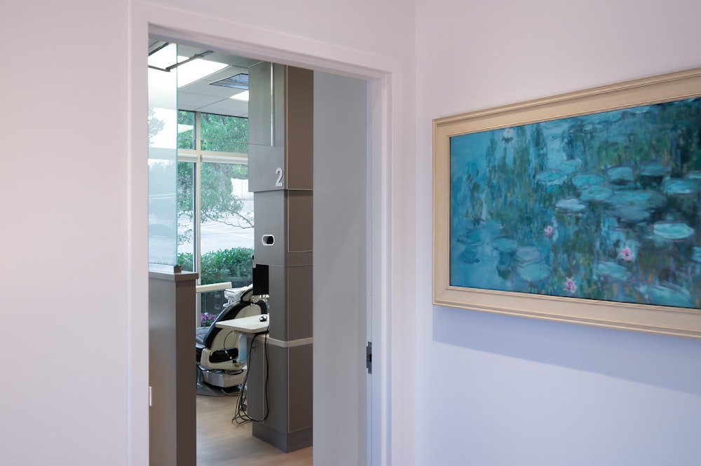 Operatory room at Allan S. Thomas dental office with treatment chair and large window