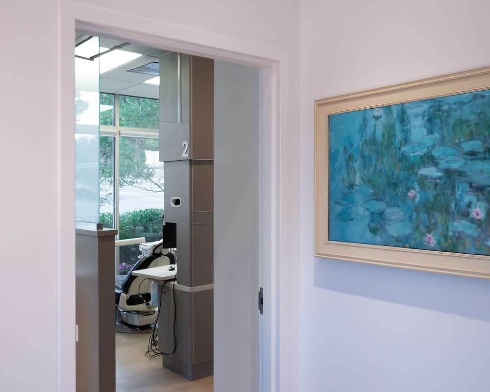 Operatory room at Allan S. Thomas dental office with treatment chair and large window