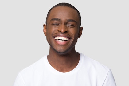 Man with very white teeth smiling