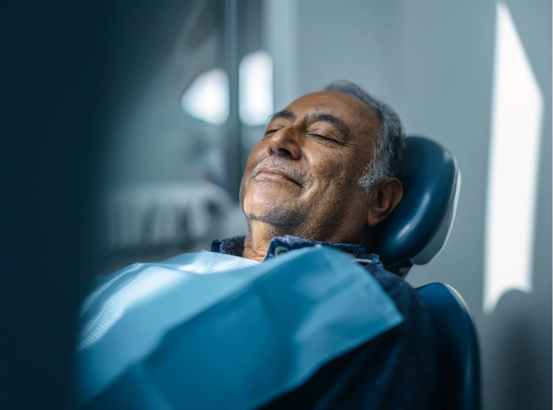 man reclining in dentist