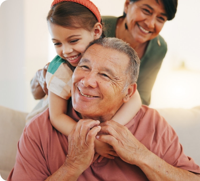 Smiling older man after dental care with family